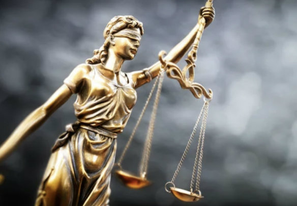 Photo of Lady Justice statue holding scales
